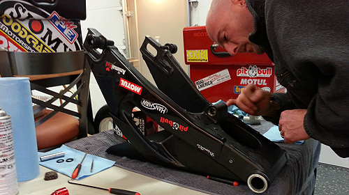 Aaron Inspecting Swingarm Dynamics